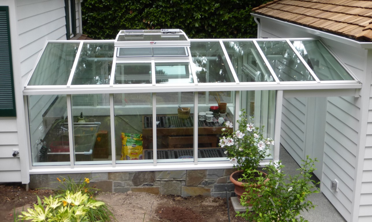 Custom greenhouse-style sunroom built for Florida climate