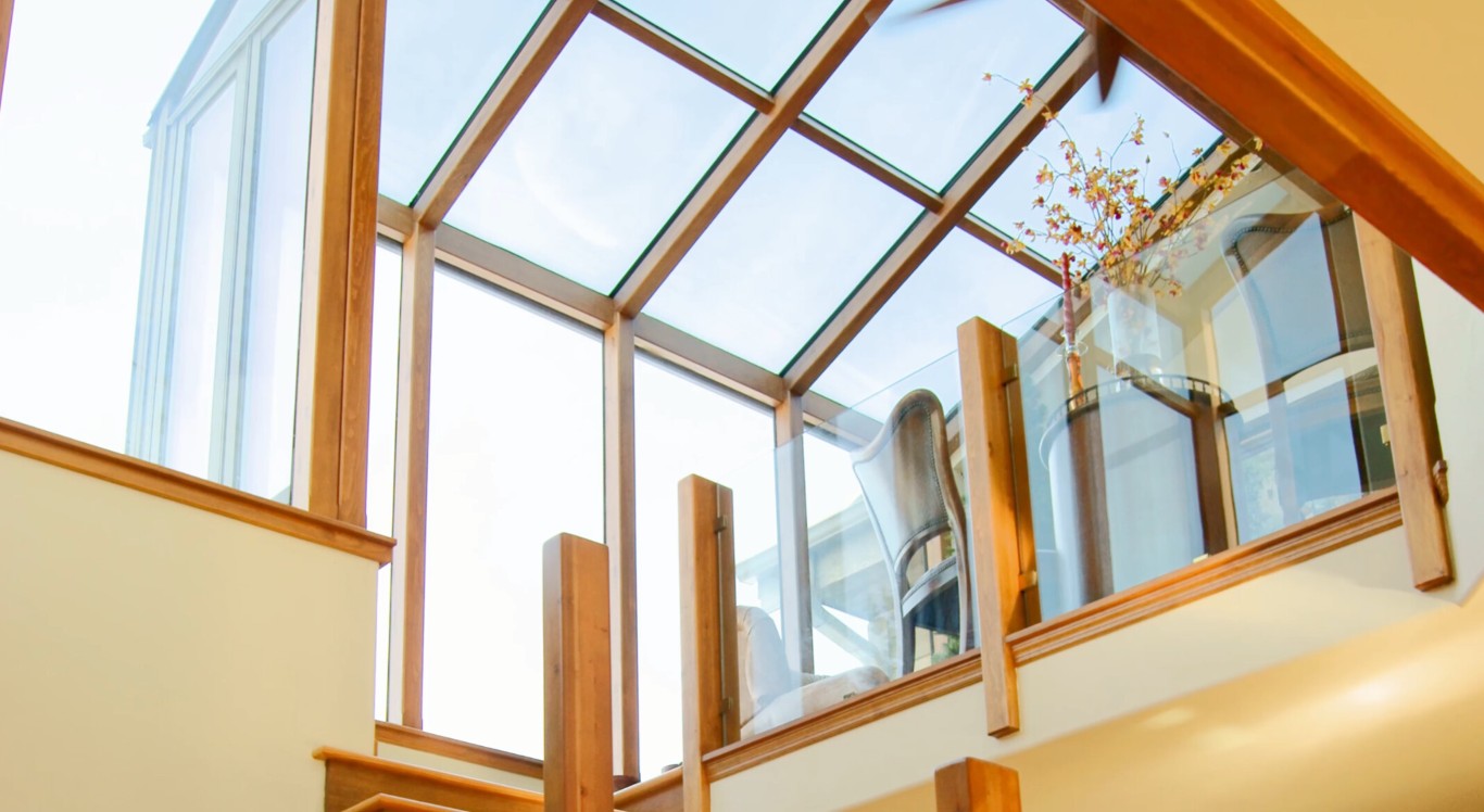 Sunroom interior showing abundant natural light from glass roof panels